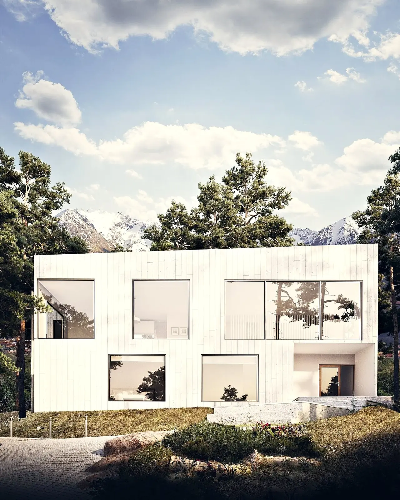 Vivienda Chiesa Guarido, volumen blanco con grandes ventanales entre árboles